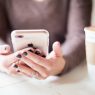 negative-space-hands-phone-nails-coffee